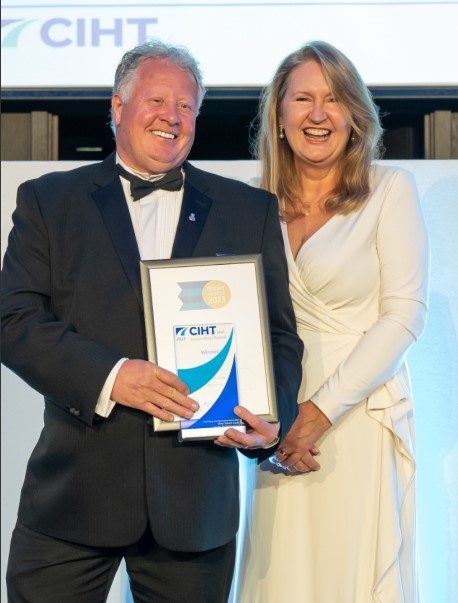 Headshot of Steve Pearson, Steve is pictured on the left after being presented an award.