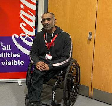 Mohamma Kohaeealle sitting in his wheelchair by a door photo