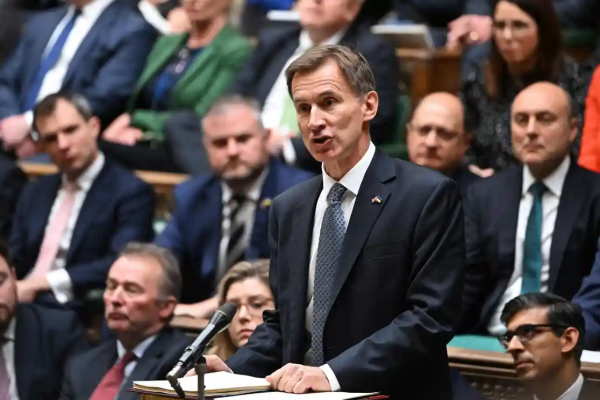 Chancellor Jeremy Hunt making his autumn statement in the House of Commons, 17 November. Photograph: Jessica Taylor/UK Parliament/AFP/Getty Images